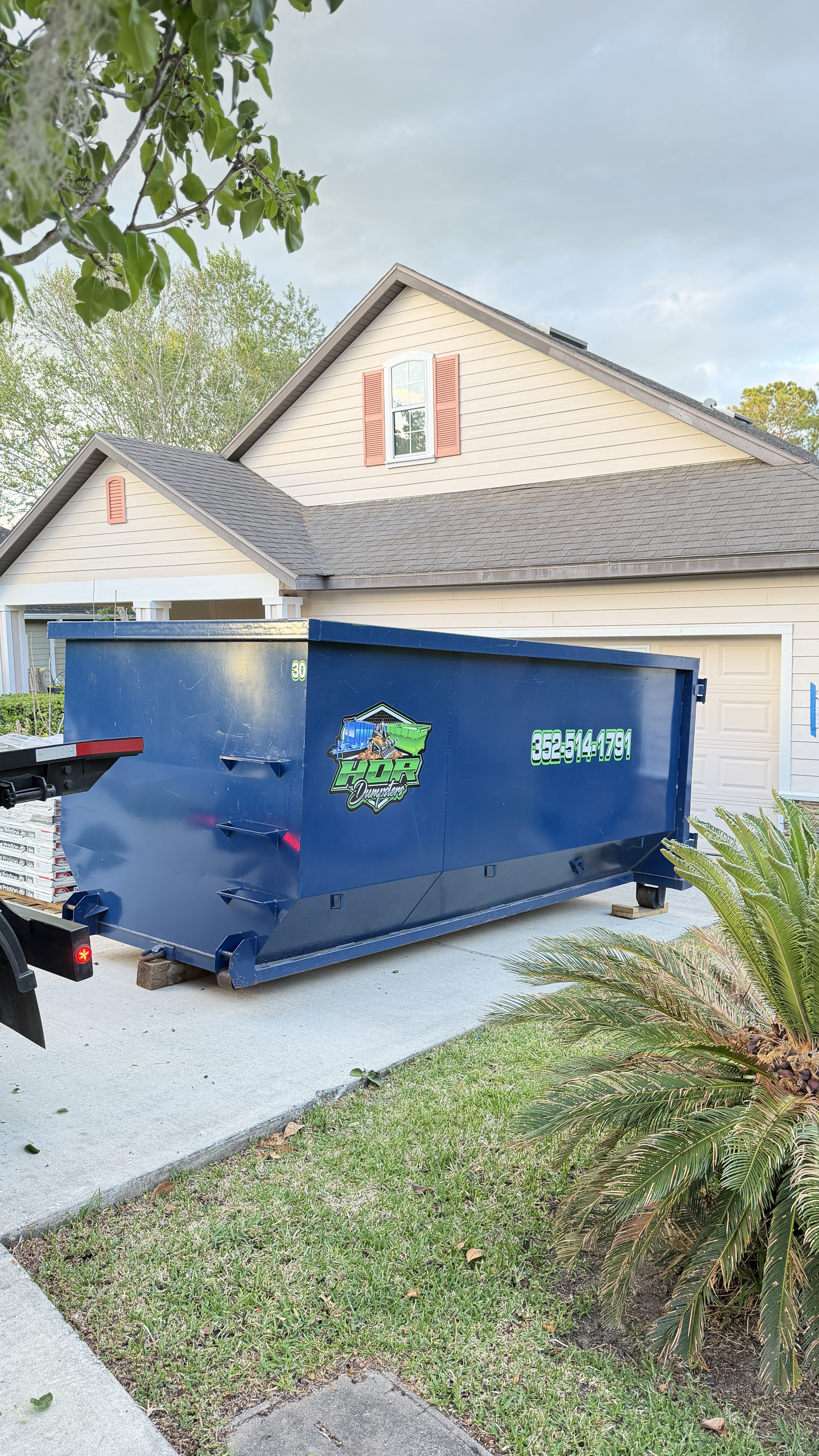 20-yard HDR Dumpster delivered to a residential driveway, ready for a big cleanout